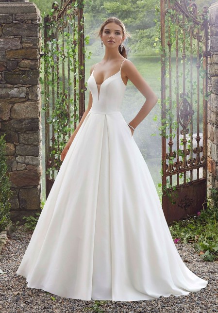 leeveless peau de soie bridal ball gown with spaghetti straps. This elegant gown features a low cut sheer back accented with covered buttons. 